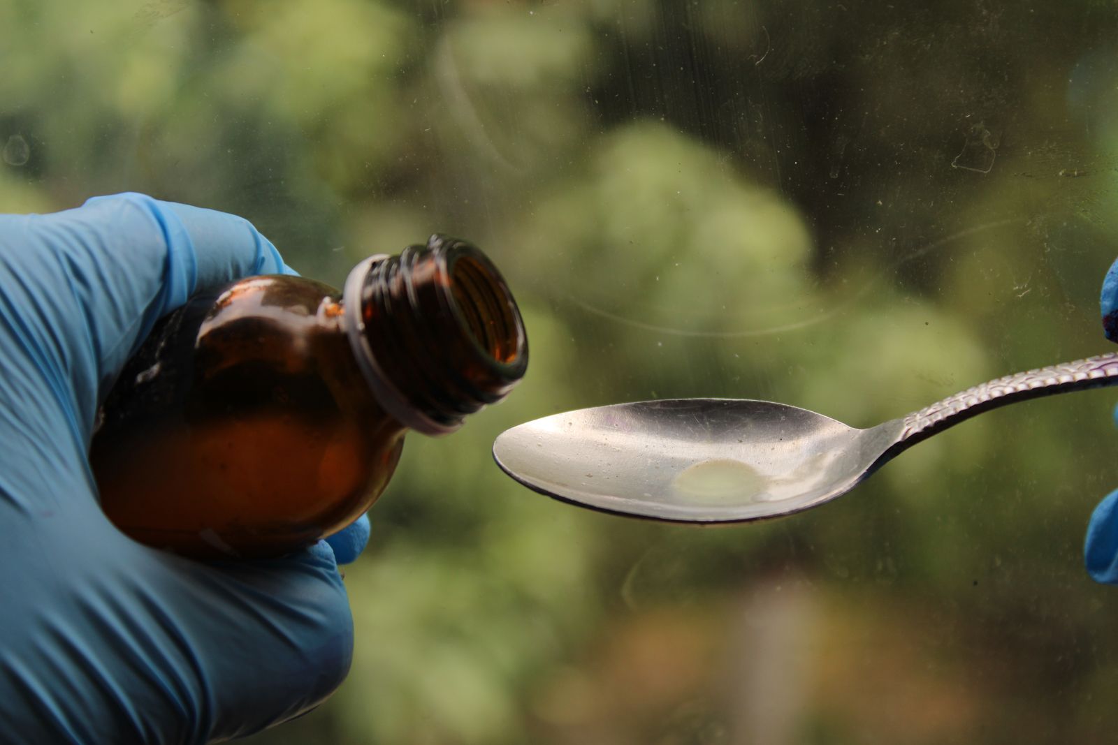 Bottle of Flagyl (metronidazole) syrup for children with dosing spoon