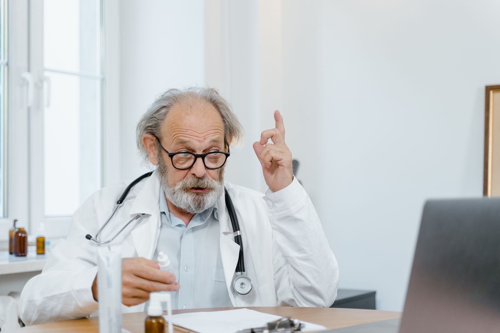 Person in Multan using smartphone for online doctor consultation