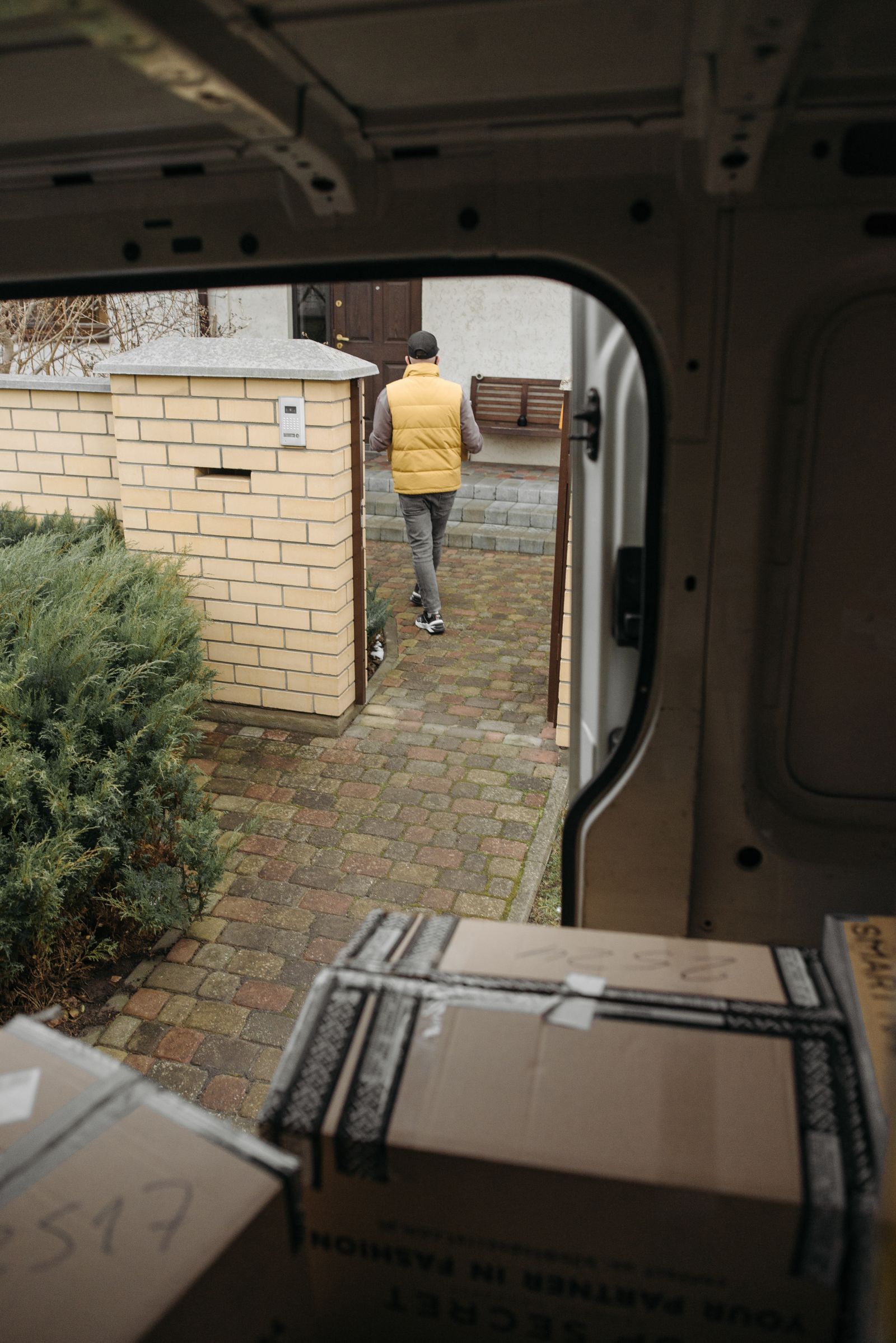 Delivery person handing over a medicine package at doorstep