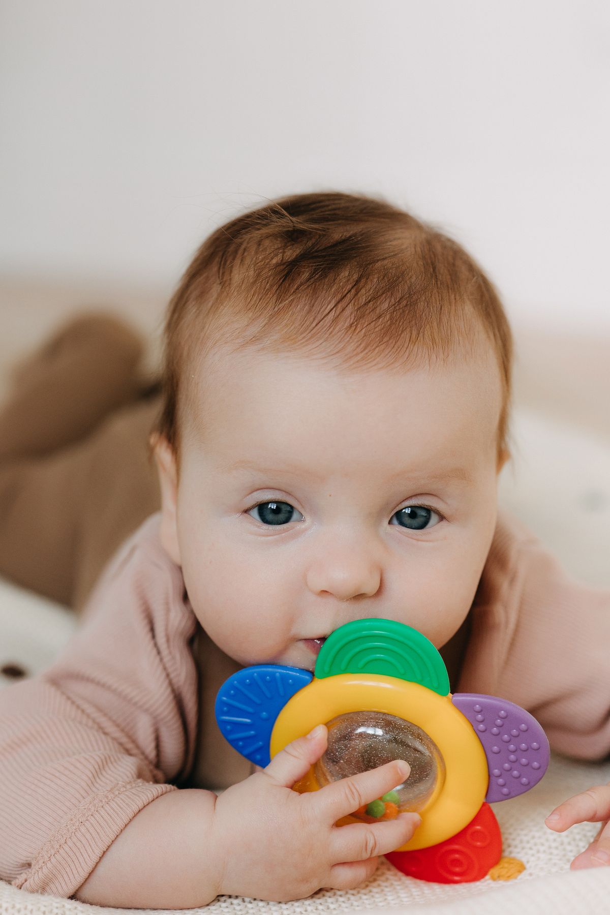 Baby with teething toy
