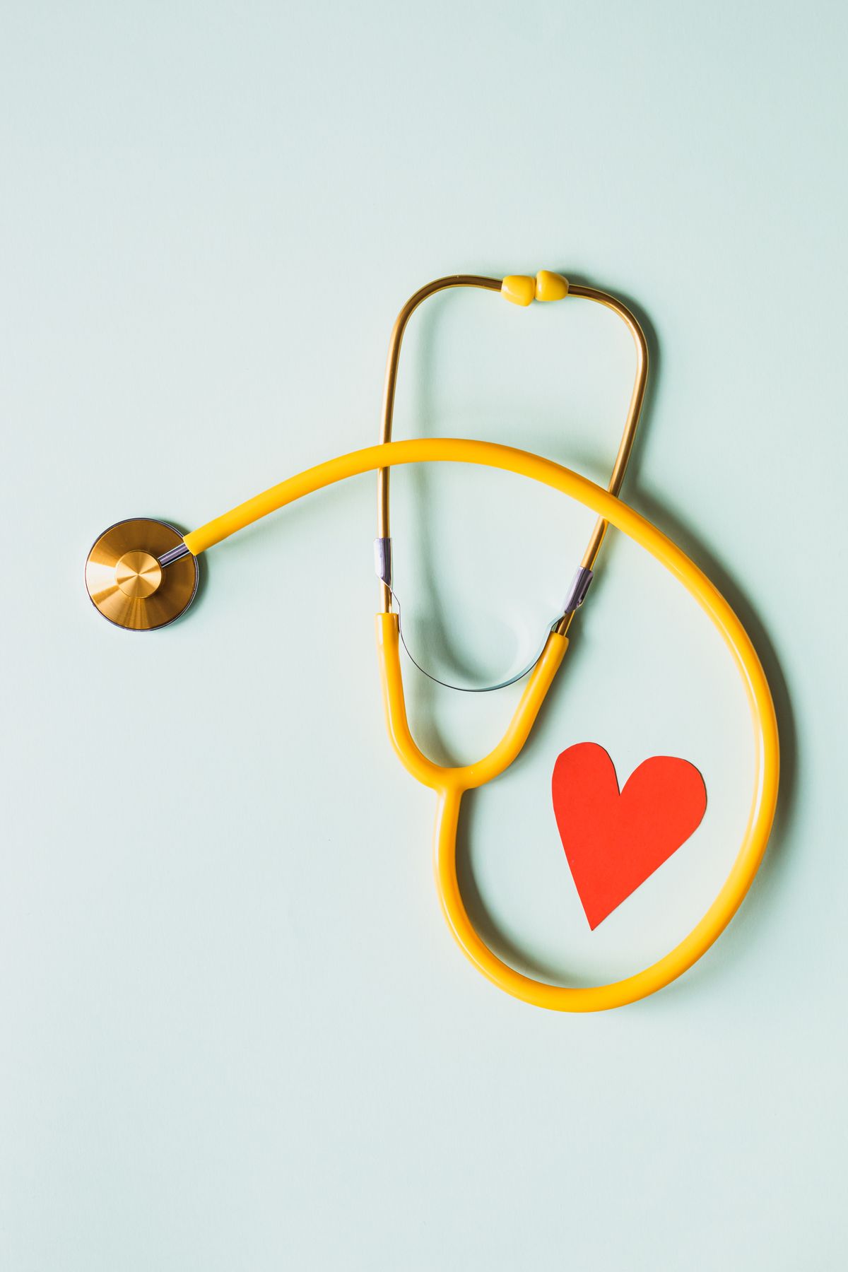 Doctor checking heart with stethoscope — heart disease