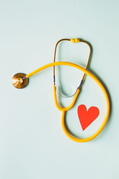 Doctor checking heart with stethoscope — heart disease