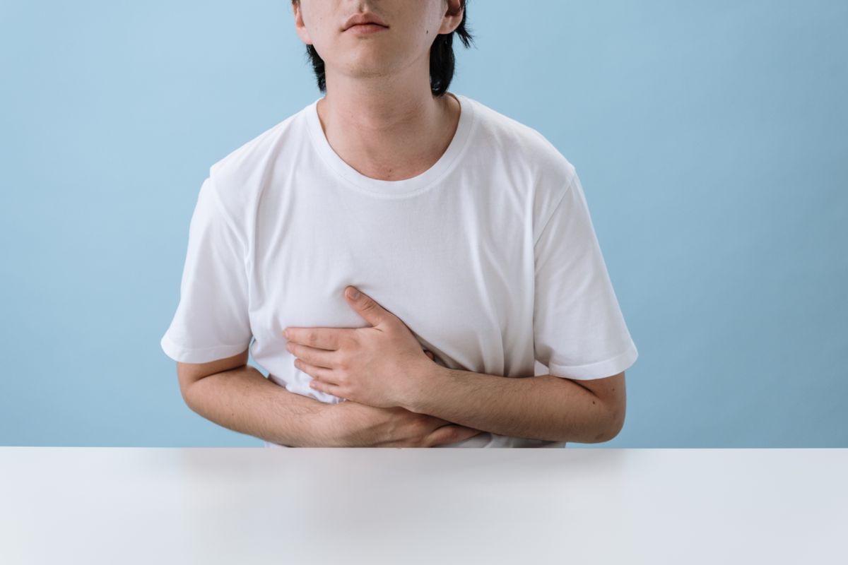 Person experiencing heartburn and acidity